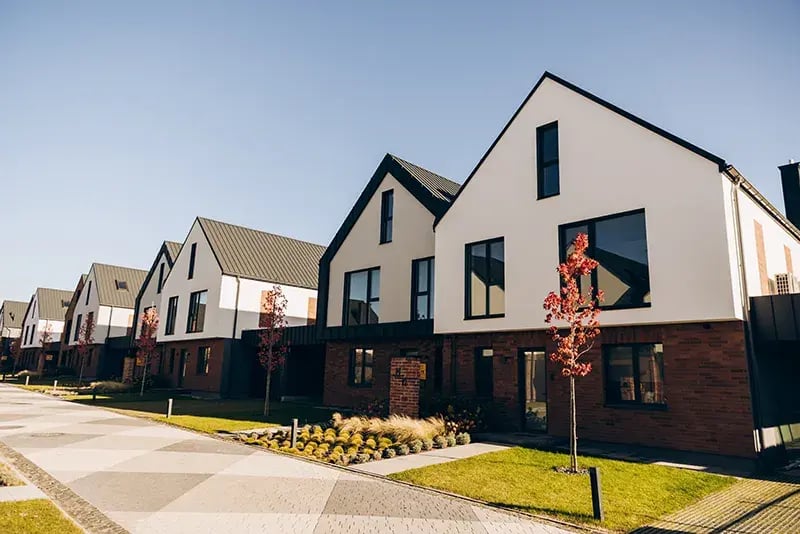 Modern housing estate with contemporary detached homes, landscaped streets and green spaces