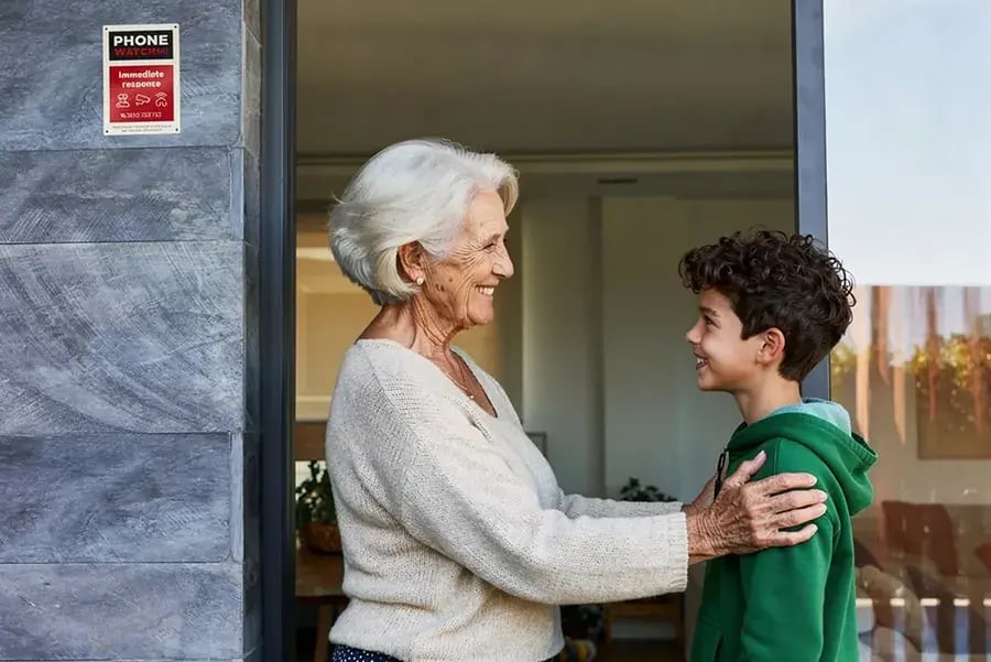 woman and boy outside home copy