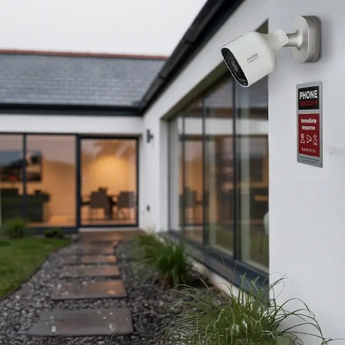 PhoneWatch outdoor security camera on a large modern Irish home, part of a full-coverage alarm system for a big house