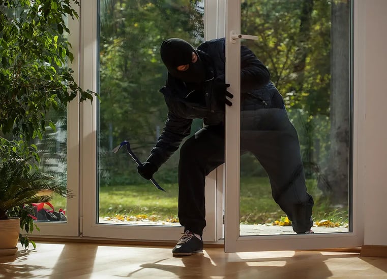 burglar breaking into home 