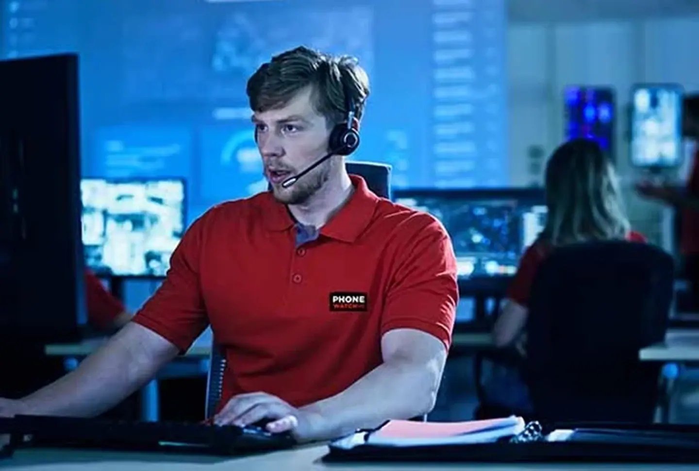 alarm centre operator looking at computer 