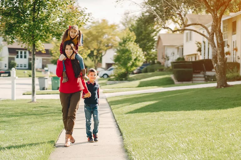 mother and daughters walking in park HS mobile