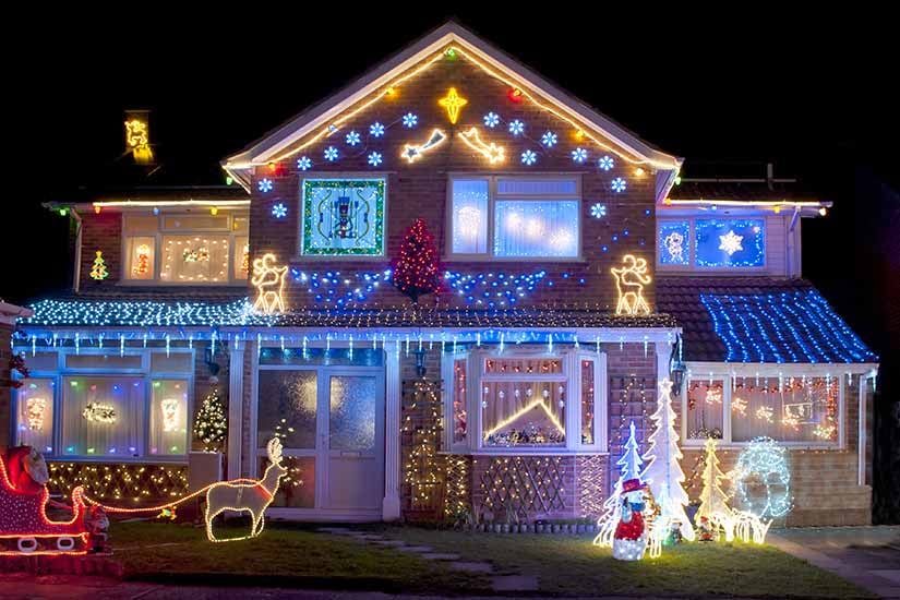 house outside decorated with Christmas lights