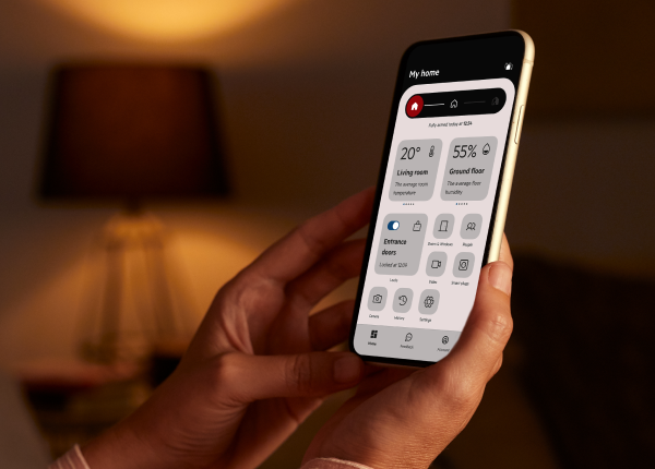 Homeowner using the PhoneWatch app to control a smart alarm system in Ireland