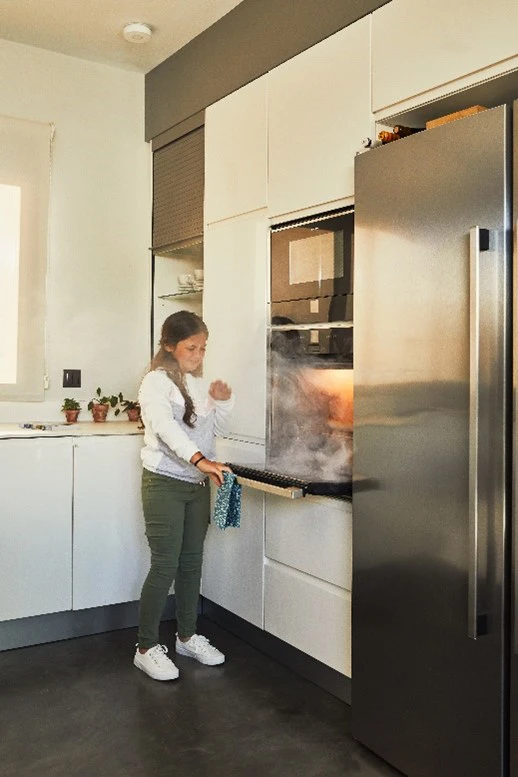 child opening over door with smoke coming out